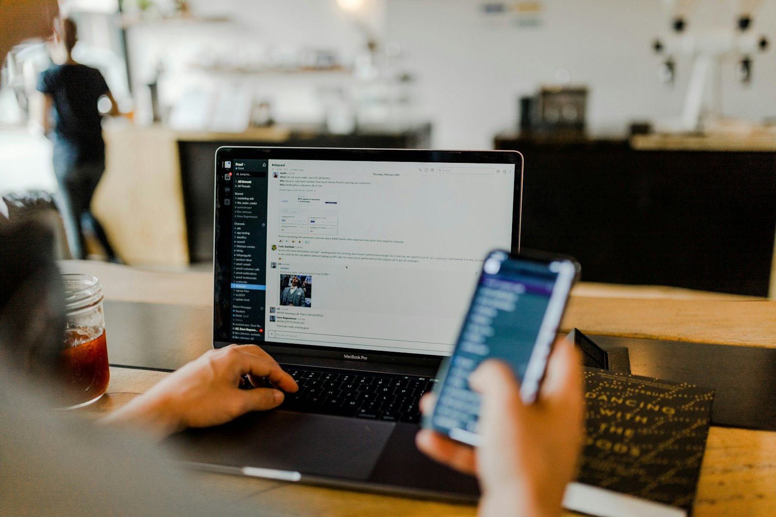 Person securing accounts on a laptop and phone